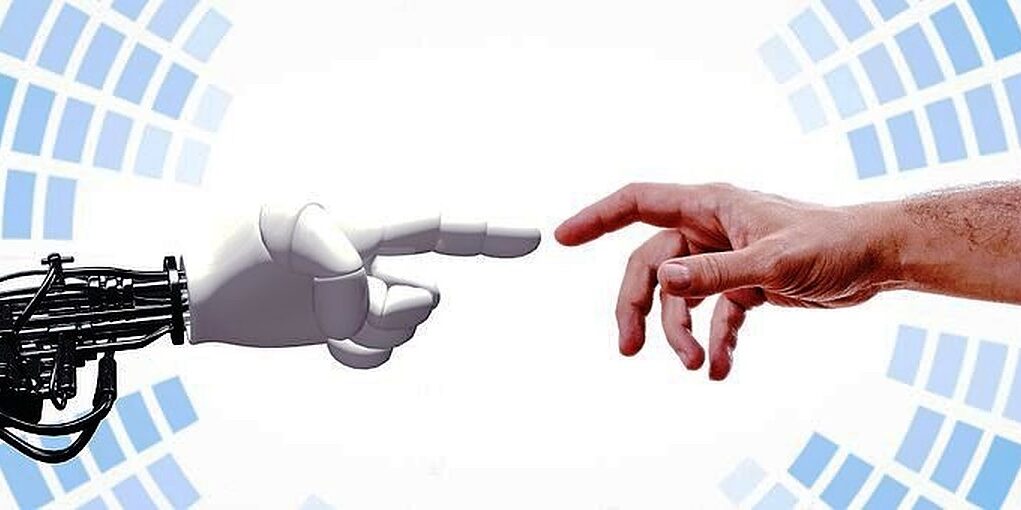 Image of a robotic hand and human hand almost touching, showing the rise of robots and impact on the global workspace